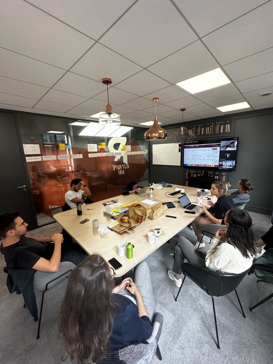 The team mapping the end-to-end student journey on a glass wall